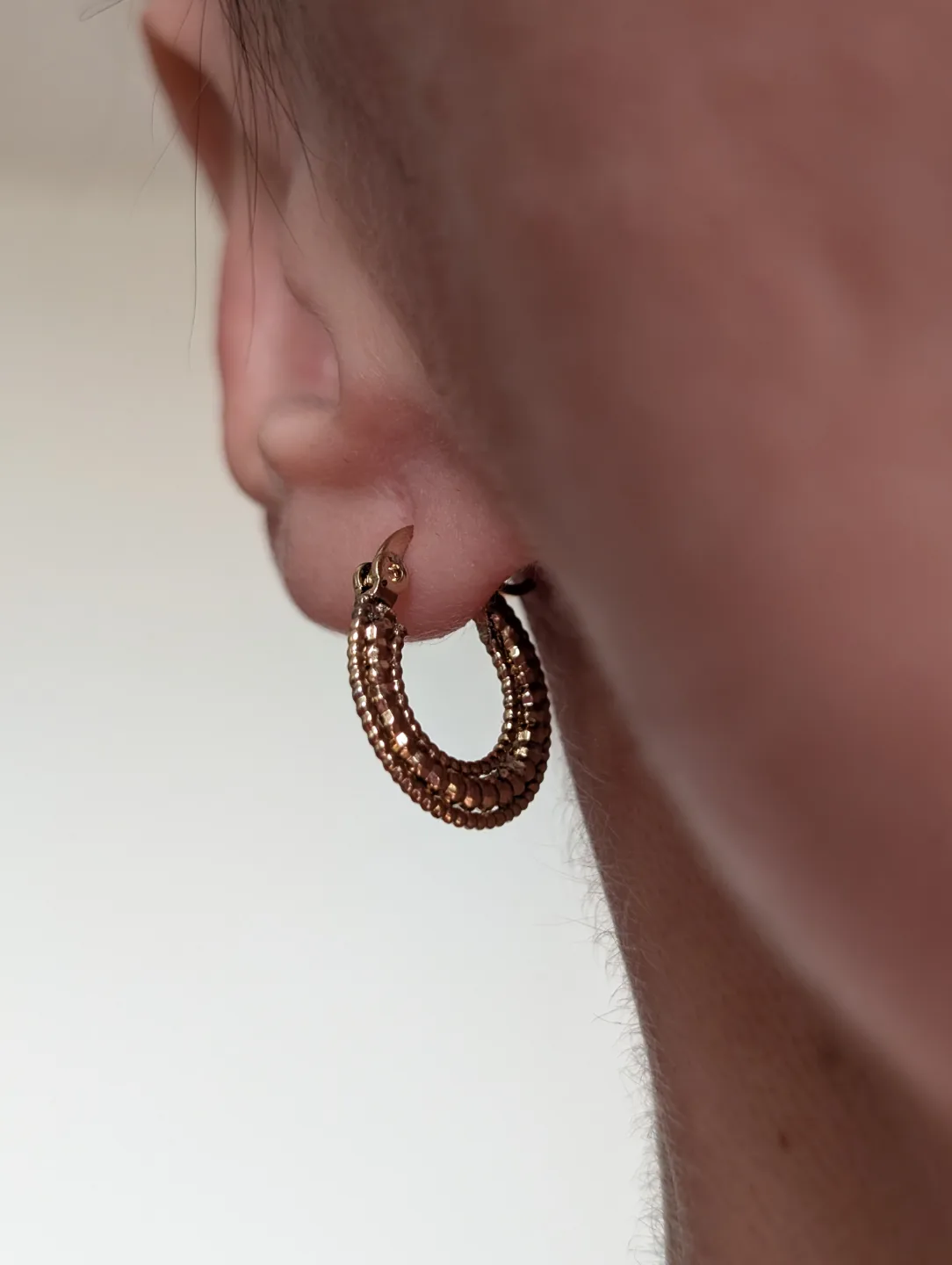 Small Gold Tone textured hoop earrings image indicator(7)