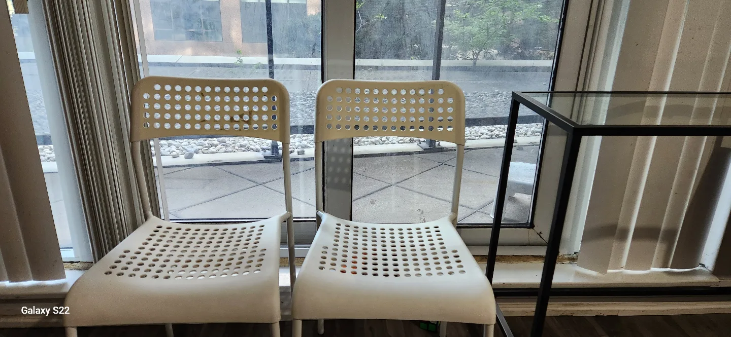 Pair of White Plastic Chairs thumbnail