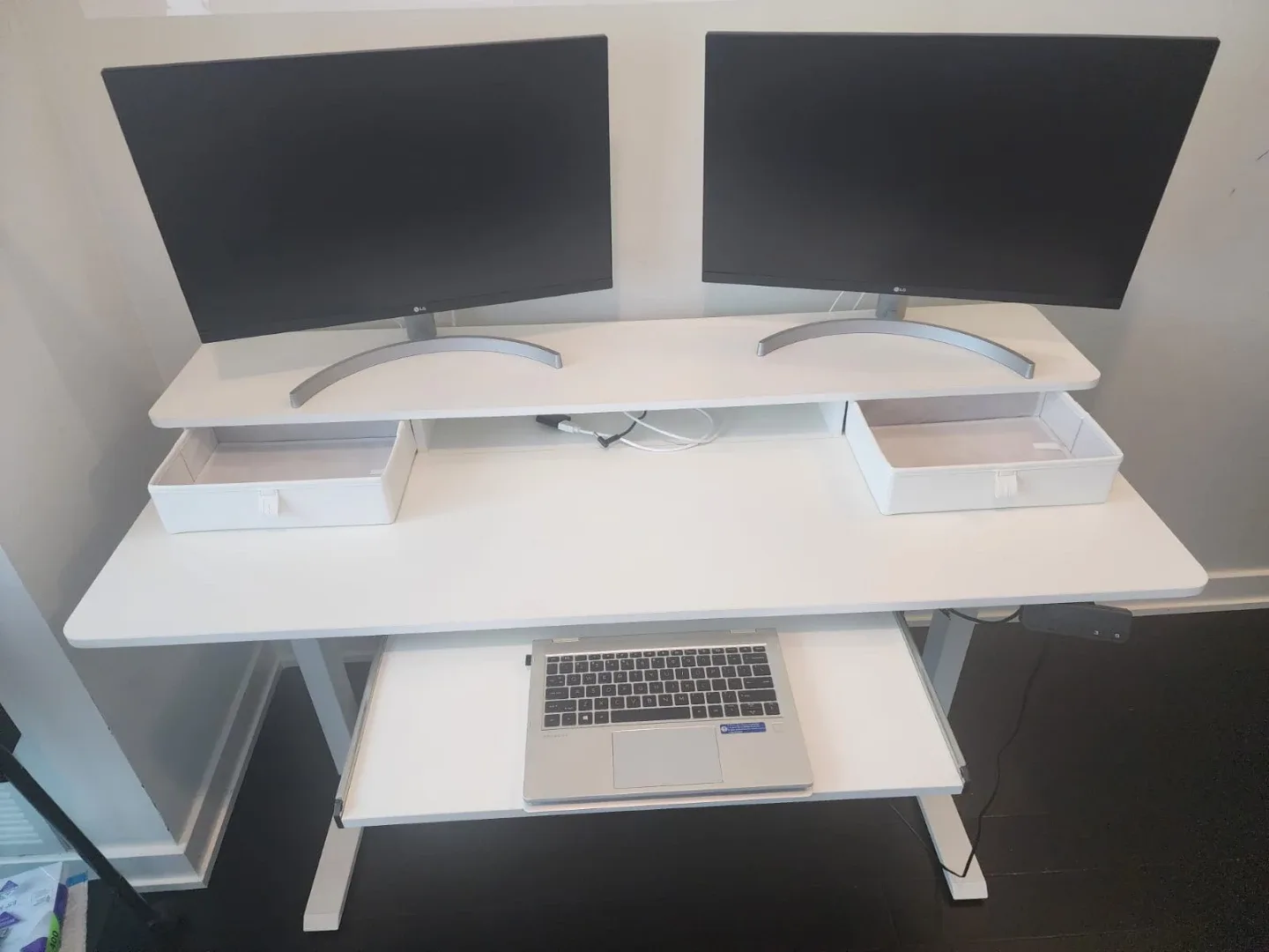 White Electric Standing Desk with Keyboard Tray and Two Monitors thumbnail