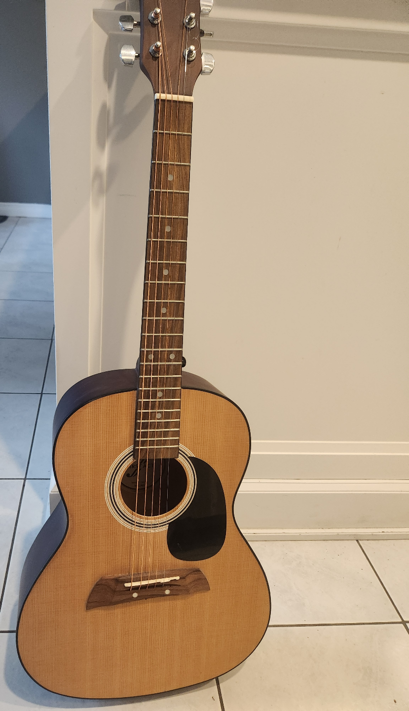 First Act Acoustic Guitar with extra string