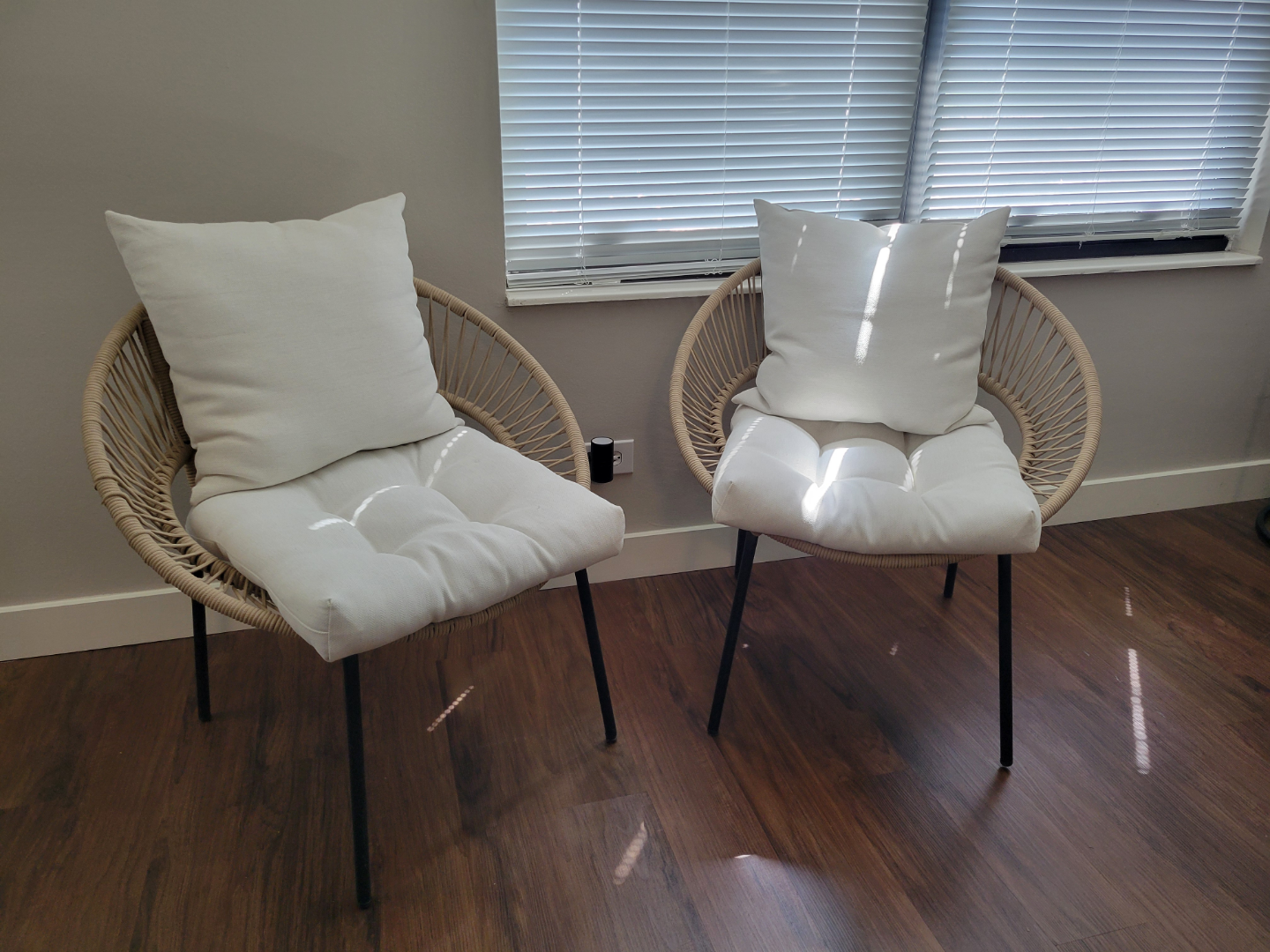 Pair of Woven Rattan Chairs with White Chevron Cushions