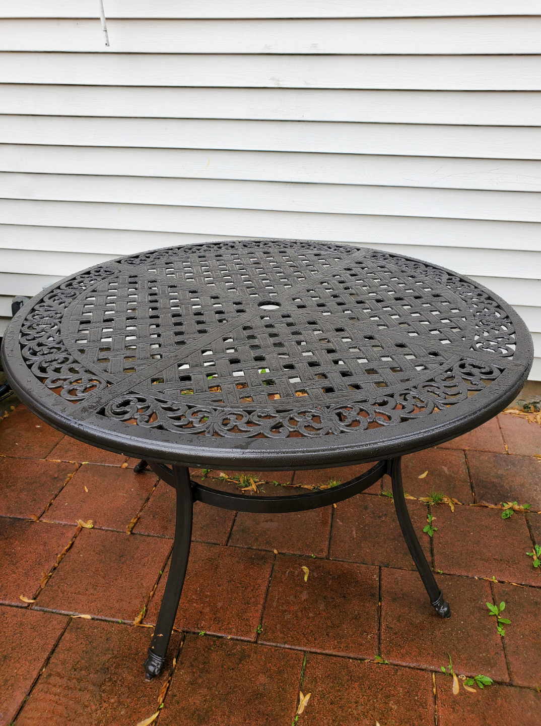 Cast metal round outdoor table