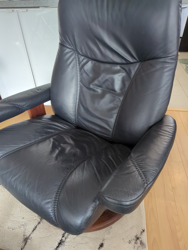 Stressless Black Leather Recliner and Ottoman