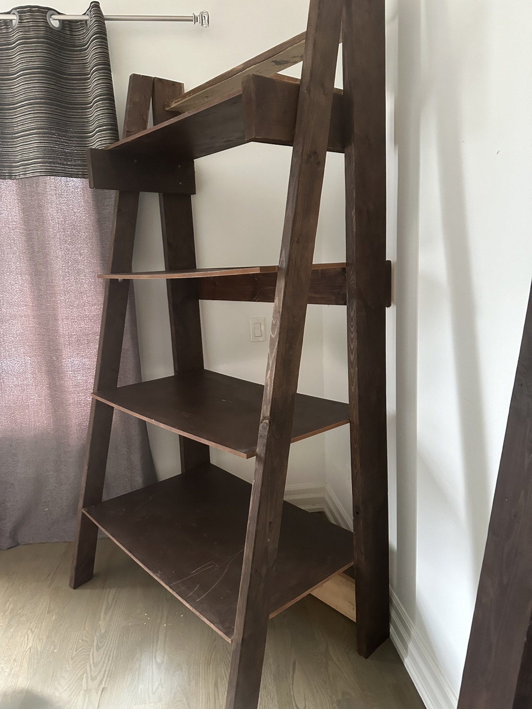 Wooden leaning bookshelf