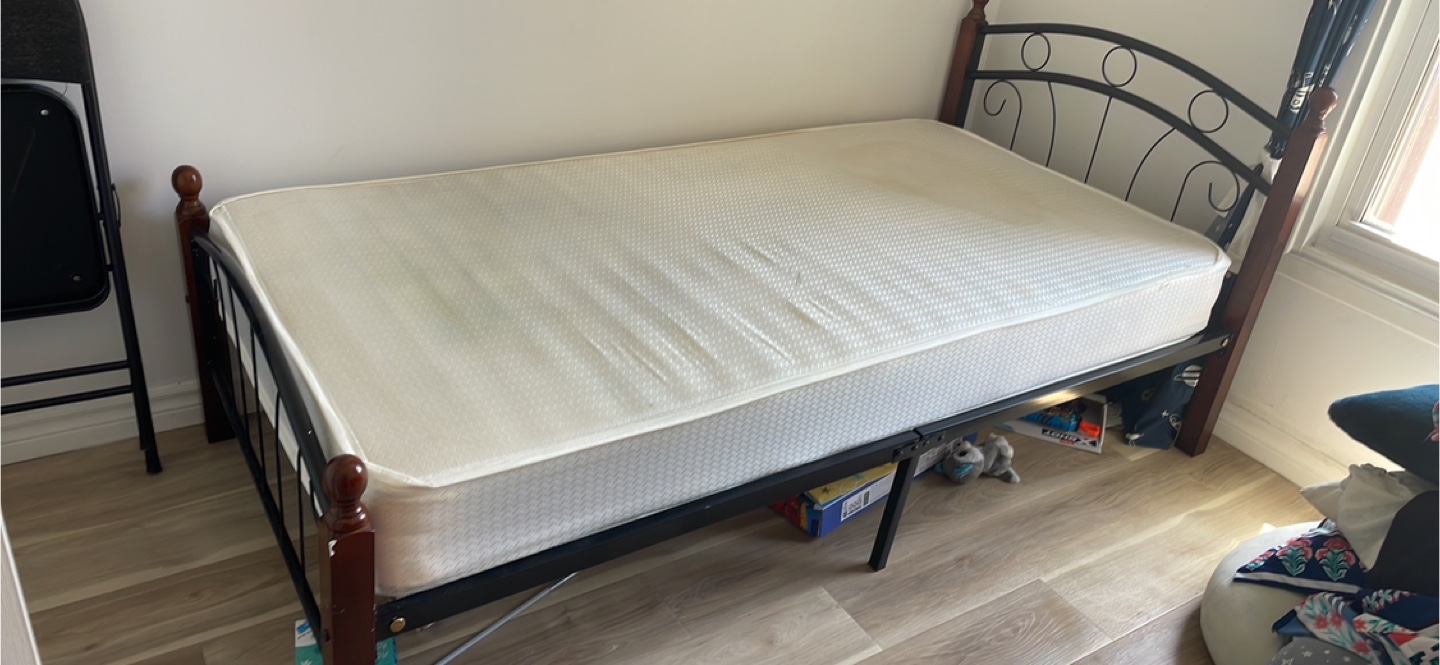Single metal bed frame with mattress