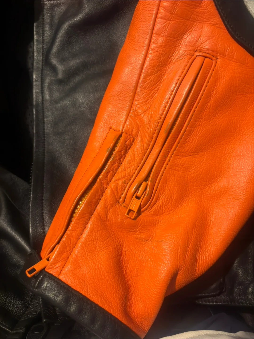 BILT Orange and Black Leather Motorcycle Jacket image indicator(8)