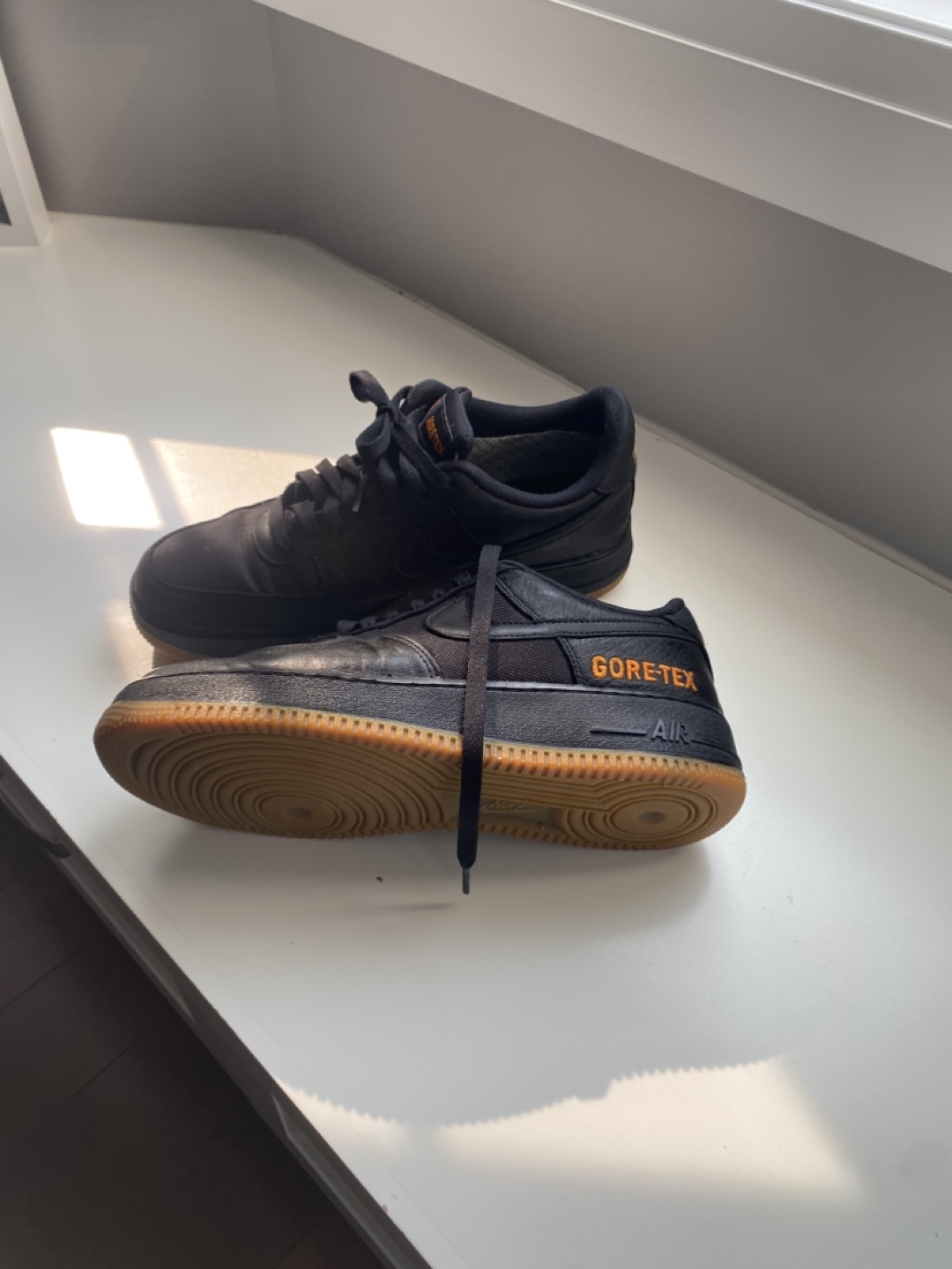 Black sneakers with orange accents