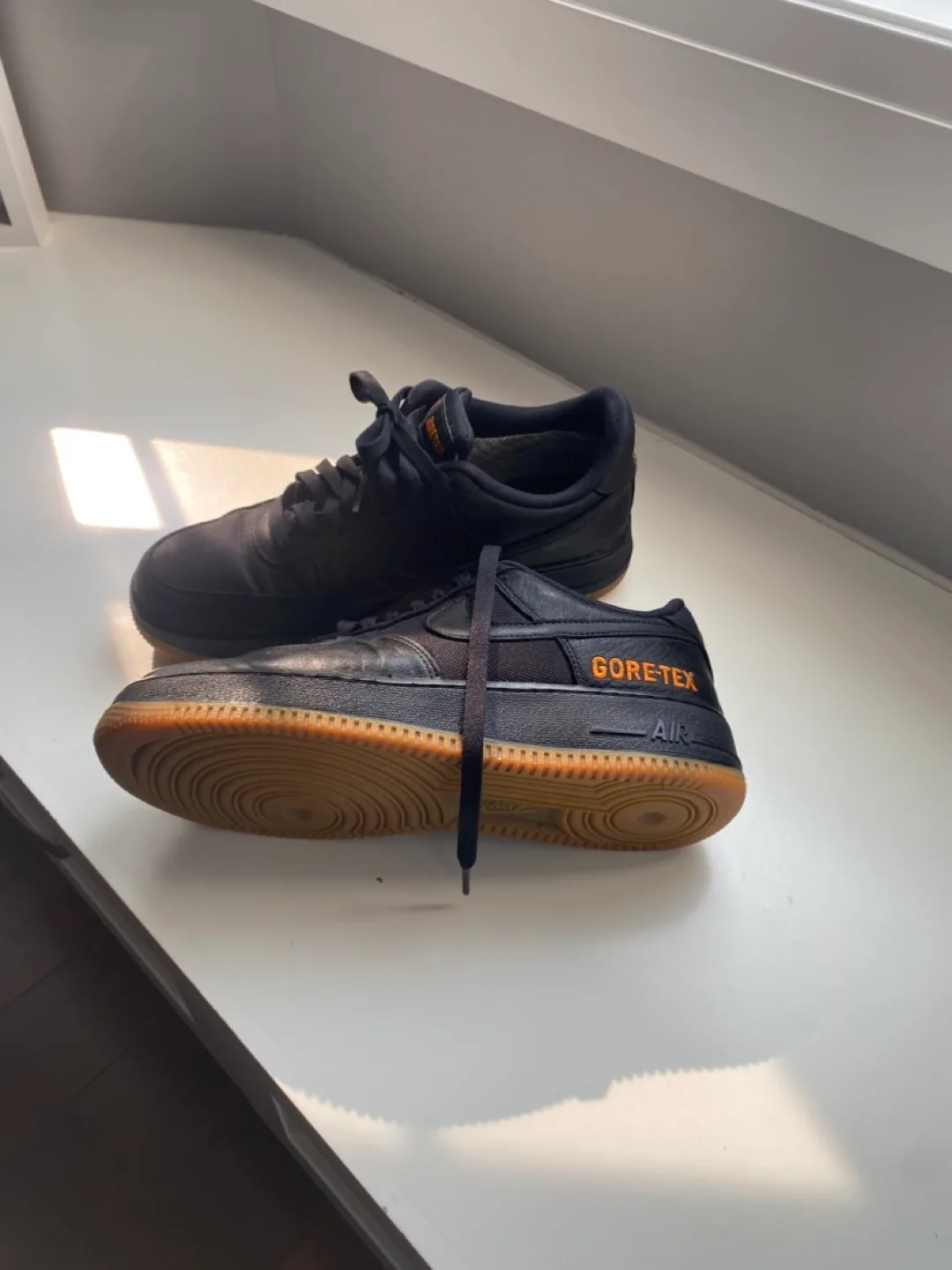 Black sneakers with orange accents thumbnail