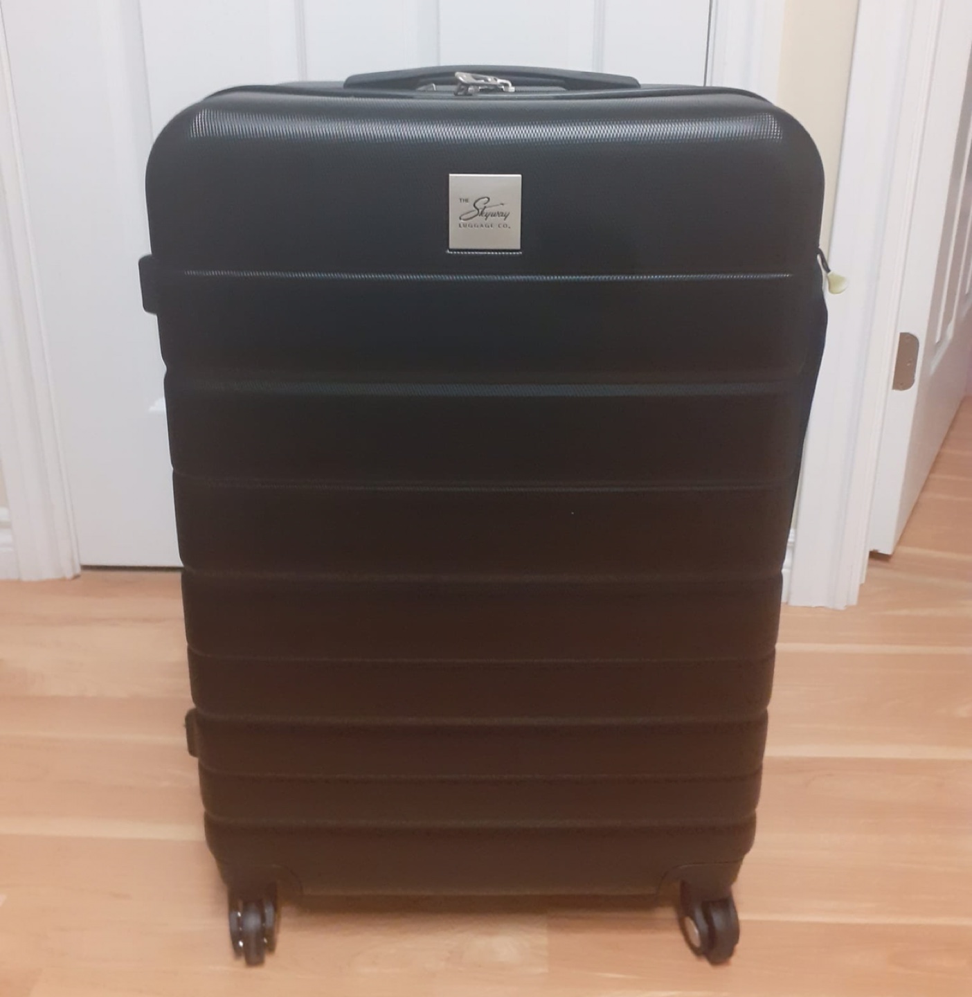 The Skyway Black Rolling Suitcase