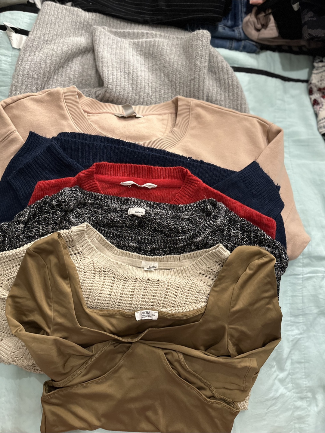 Lot of sweaters and shirts