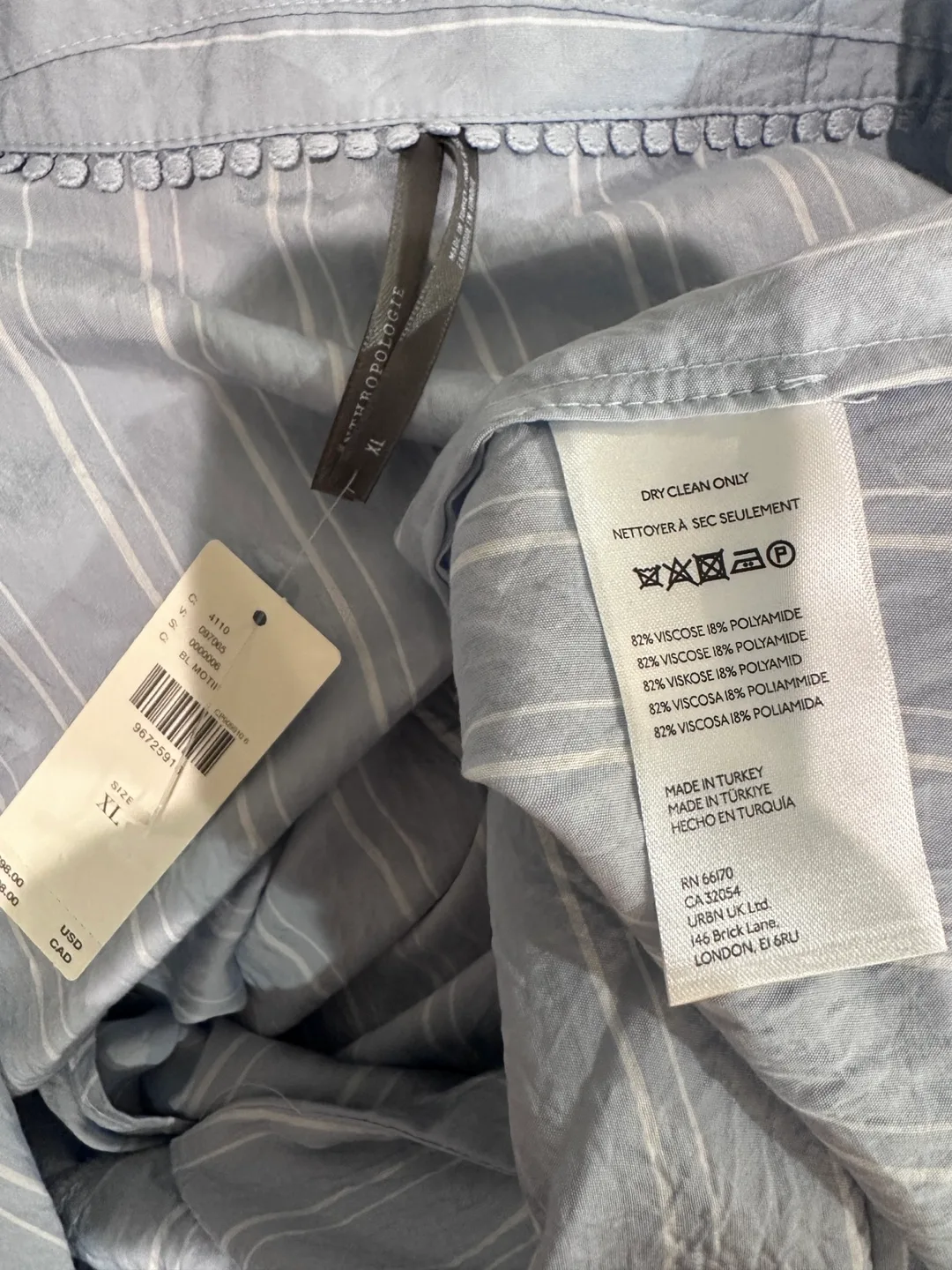 The Dylon Short Sleeve Wide-Placket Top Blue Motif XL image indicator(8)