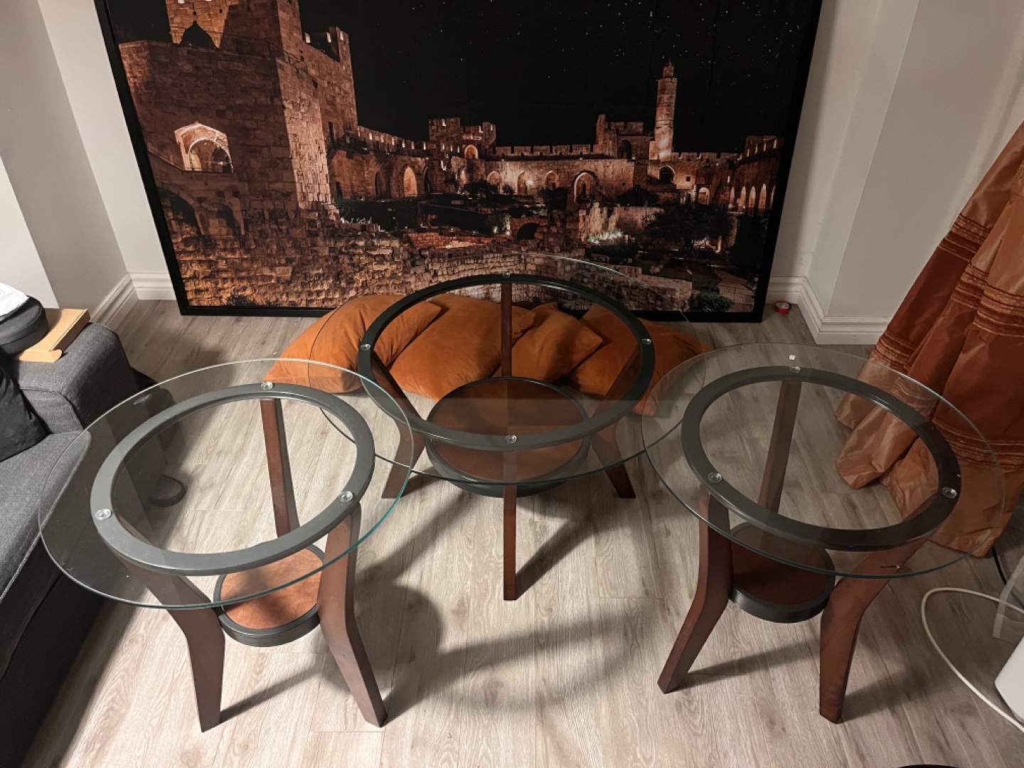 Set of three nesting glass top coffee tables