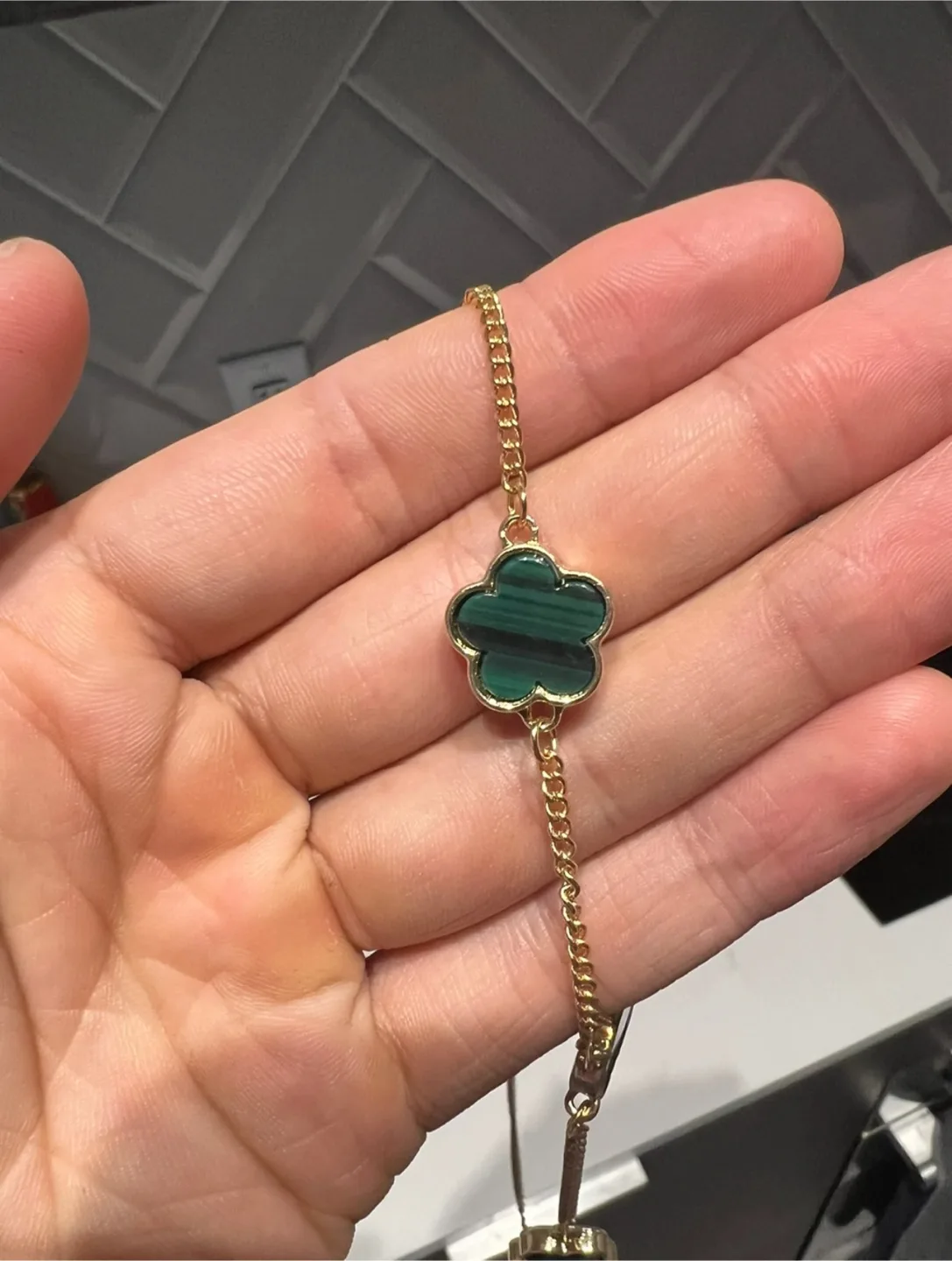 Gold-toned necklace with clover charms image indicator(3)