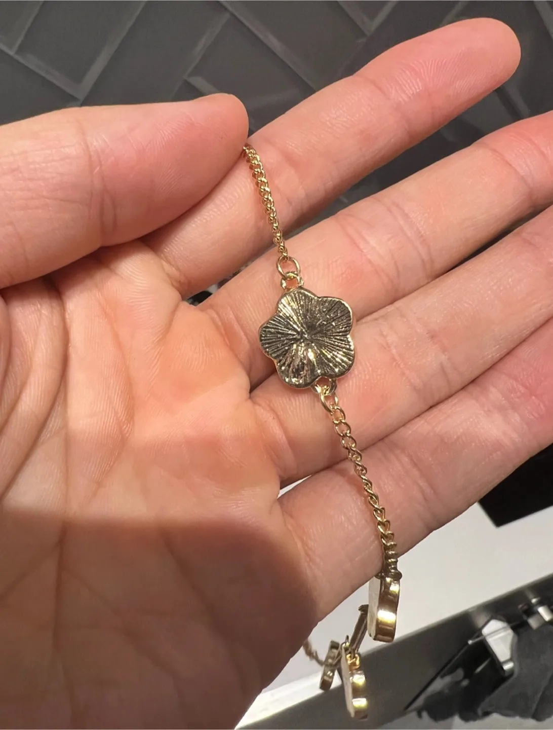 Gold-toned necklace with clover charms image indicator(5)