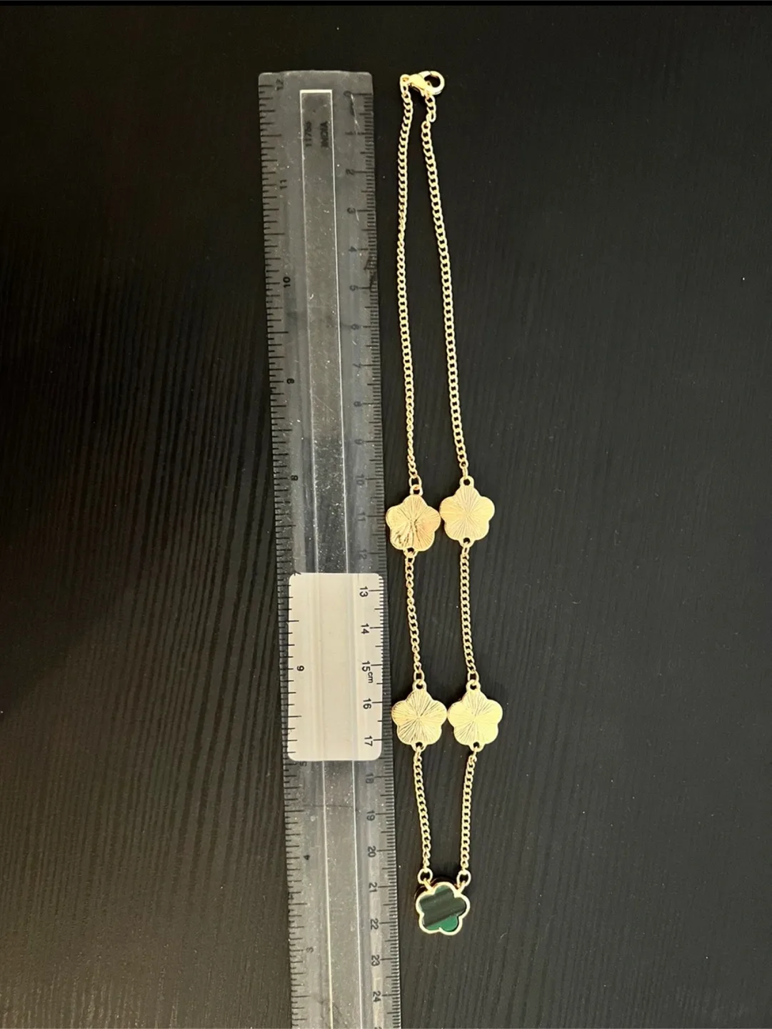 Gold-toned necklace with clover charms image indicator(6)