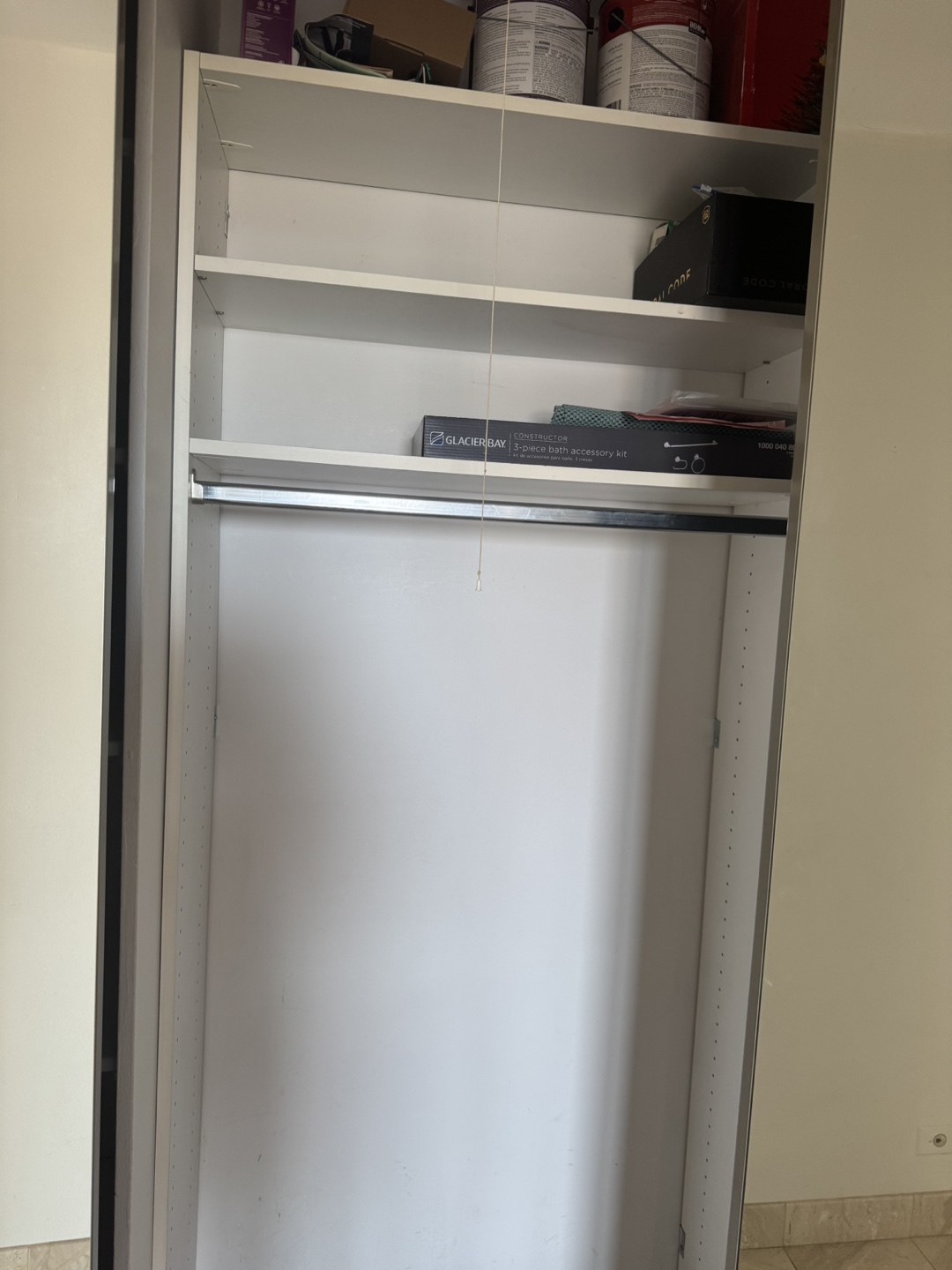 White Closet Organizer with Shelves and Rod