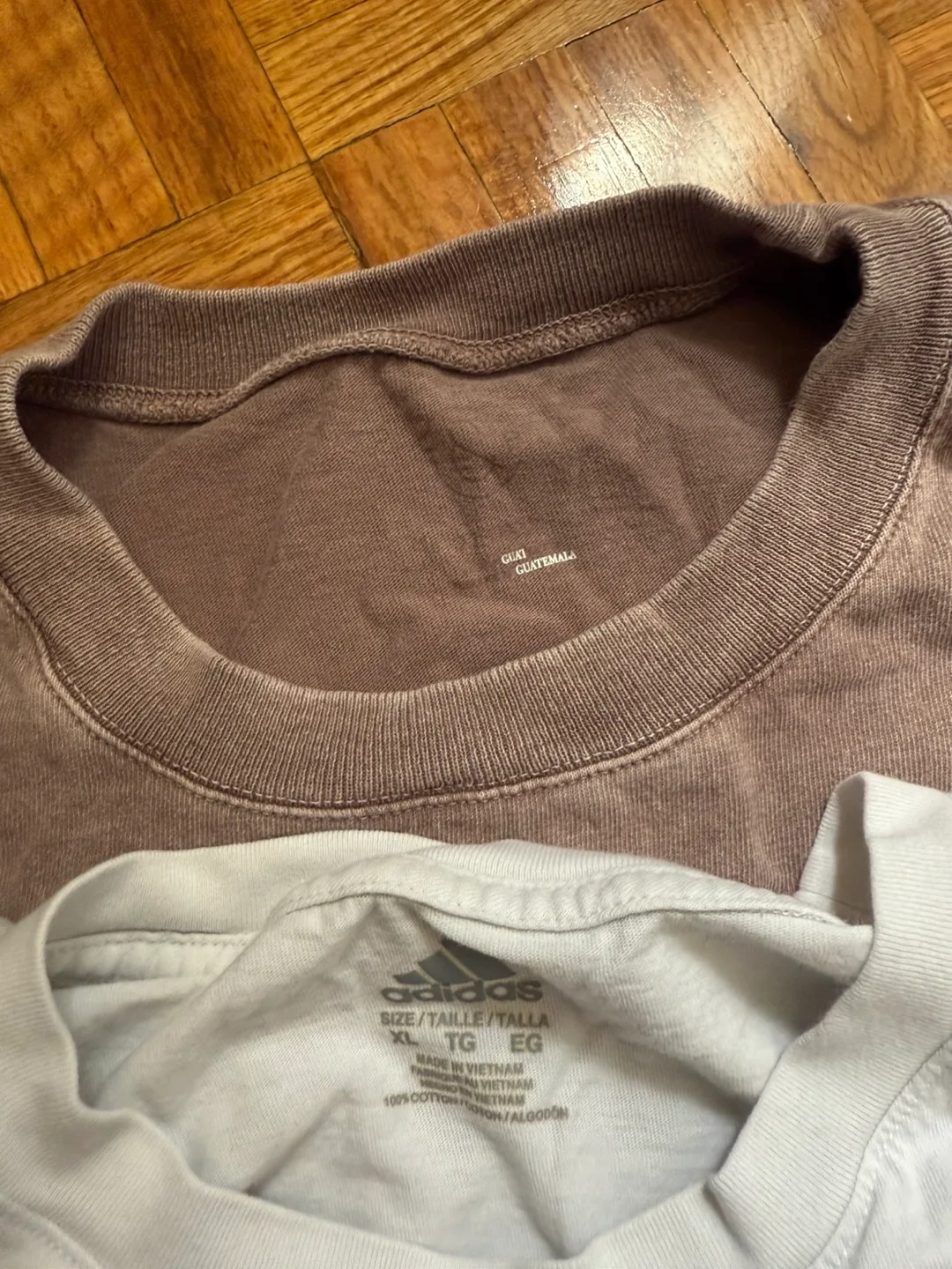 A12. Bunch of tops and t-shirts. Some are branded. image indicator(6)