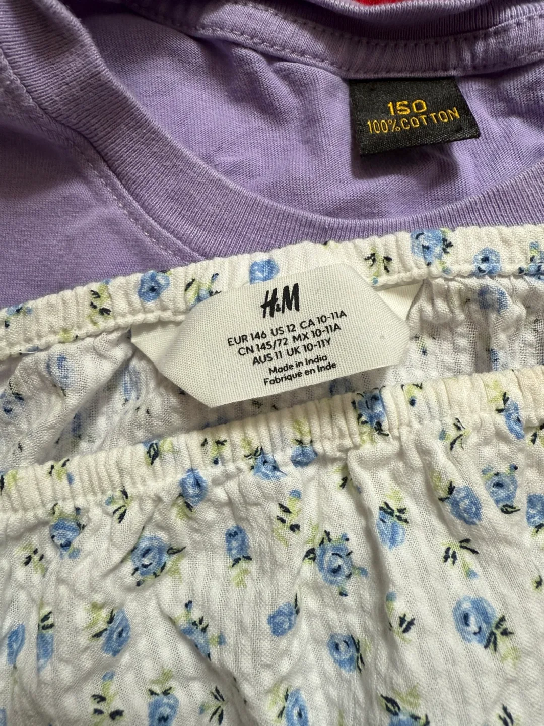 A12. Bunch of tops and t-shirts. Some are branded. image indicator(3)