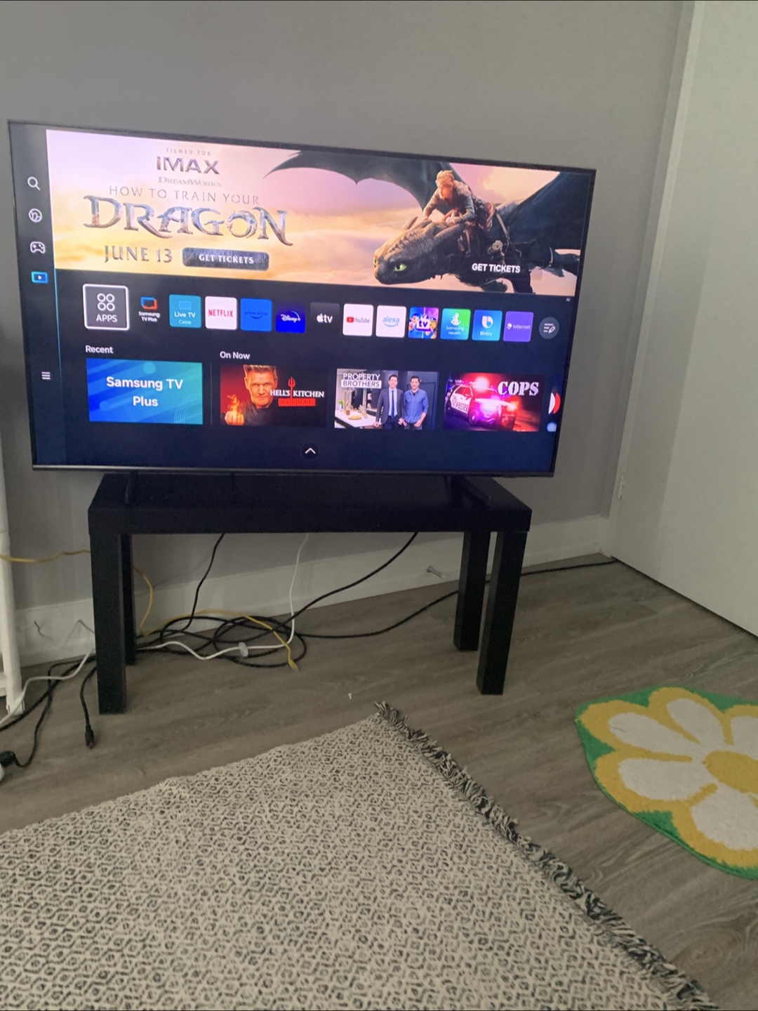 Samsung Flat Screen smart TV on stand