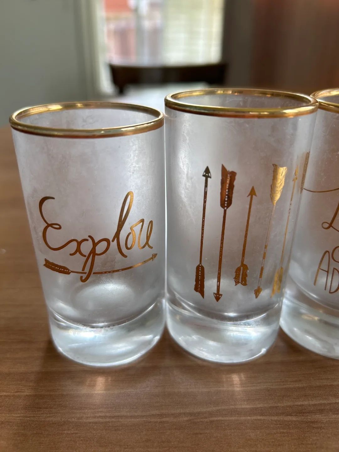 Set of 4 Shot Glasses Gold Trim explore free spirit adventure image indicator(2)