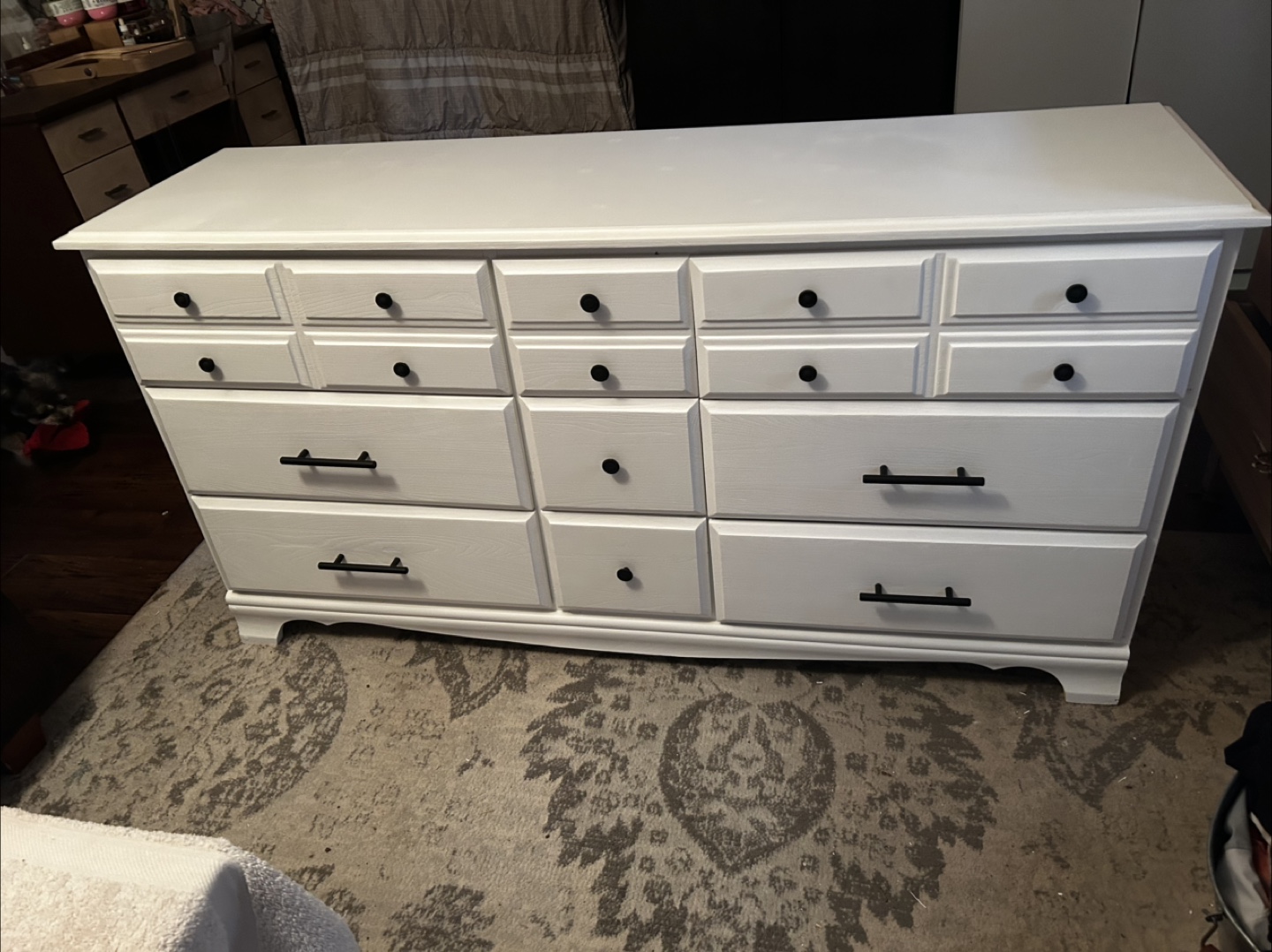 White dresser with black hardware