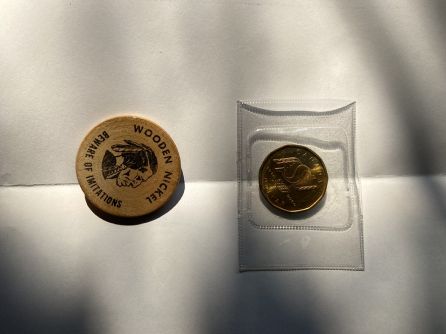 Wooden Token two Saskatchewan coins