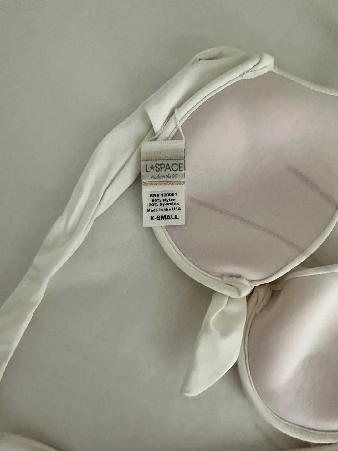 Selling brand new white LSPACE bikini top in size XS image indicator(3)