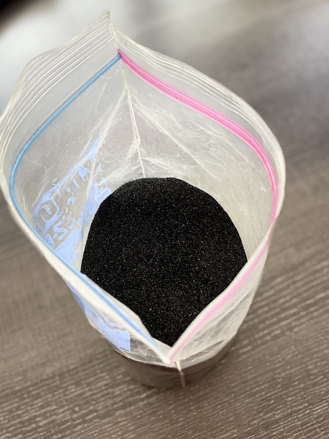 Bag of black sand