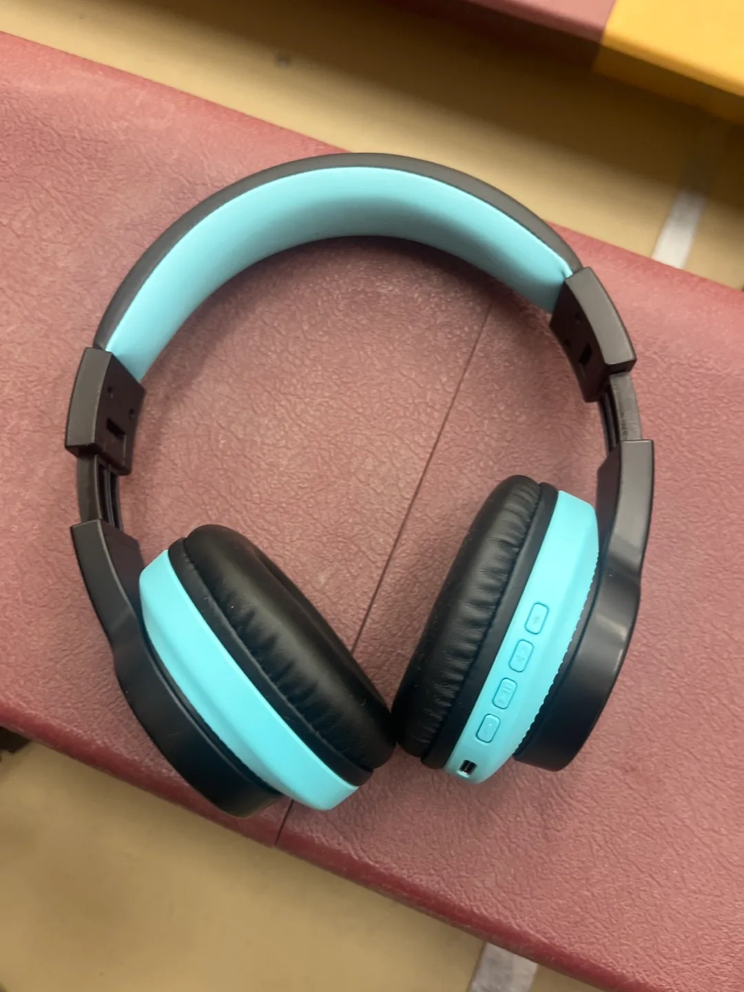 Blue and black wireless headphones thumbnail