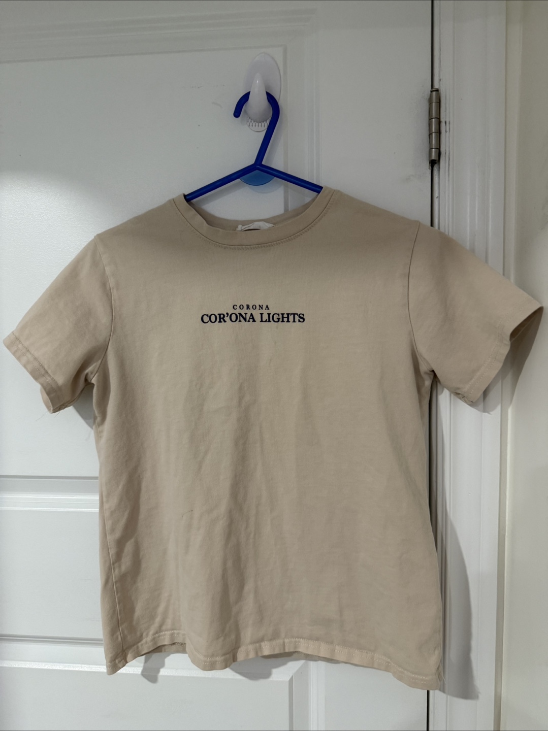 Beige T-shirt with 'Corona Cor'Ona Lights' Graphic