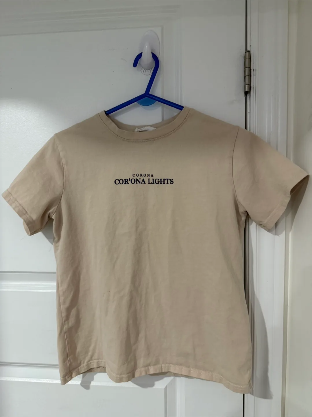 Beige T-shirt with 'Corona Cor'Ona Lights' Graphic thumbnail