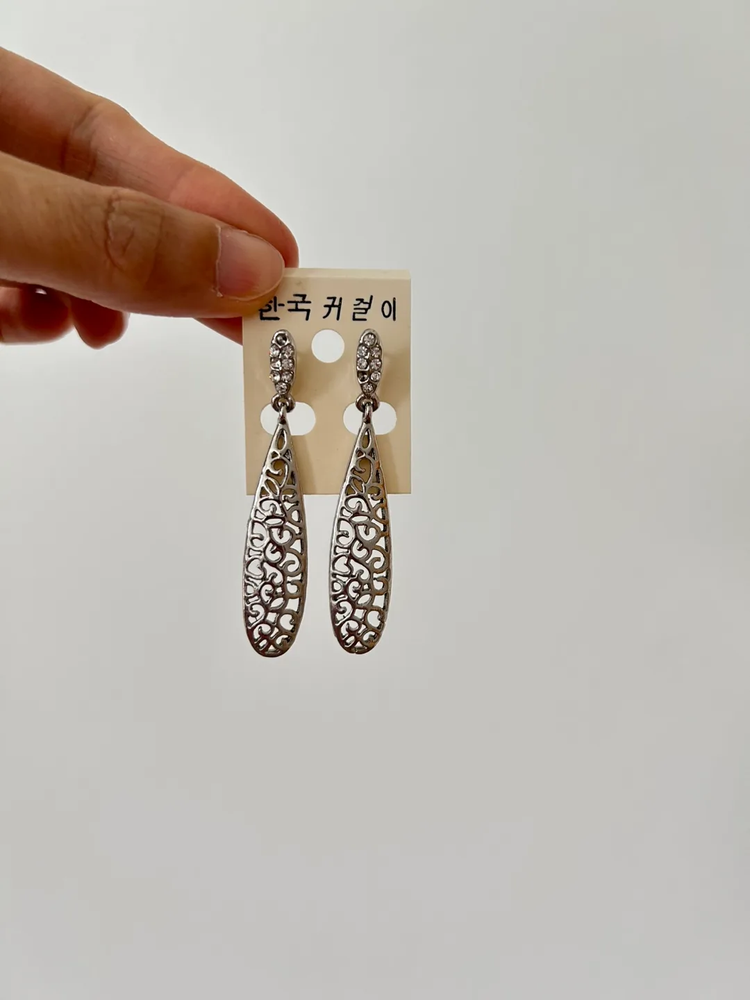 Silver coloured dangly earrings thumbnail