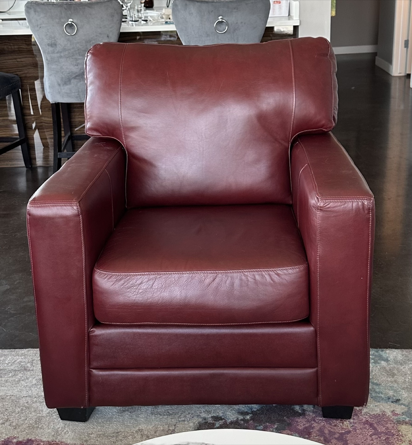 Burgundy leather chair.