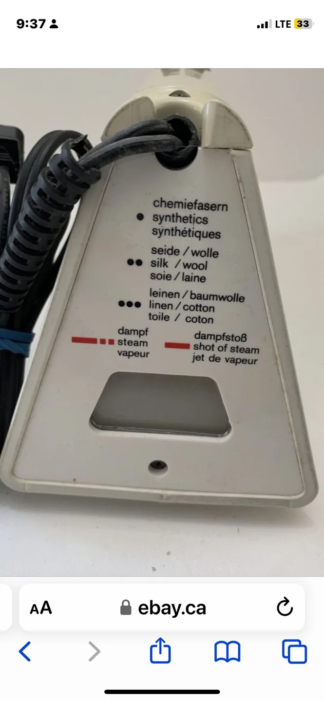 Braun iron and Ironing Board. image indicator(7)