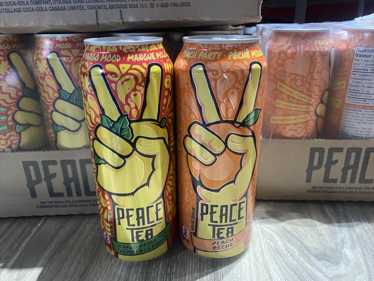 25 cans of Peace tea Mango and Peach large size