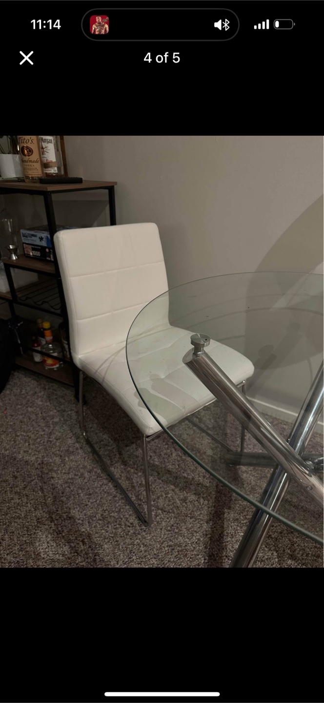 2 white leather chairs