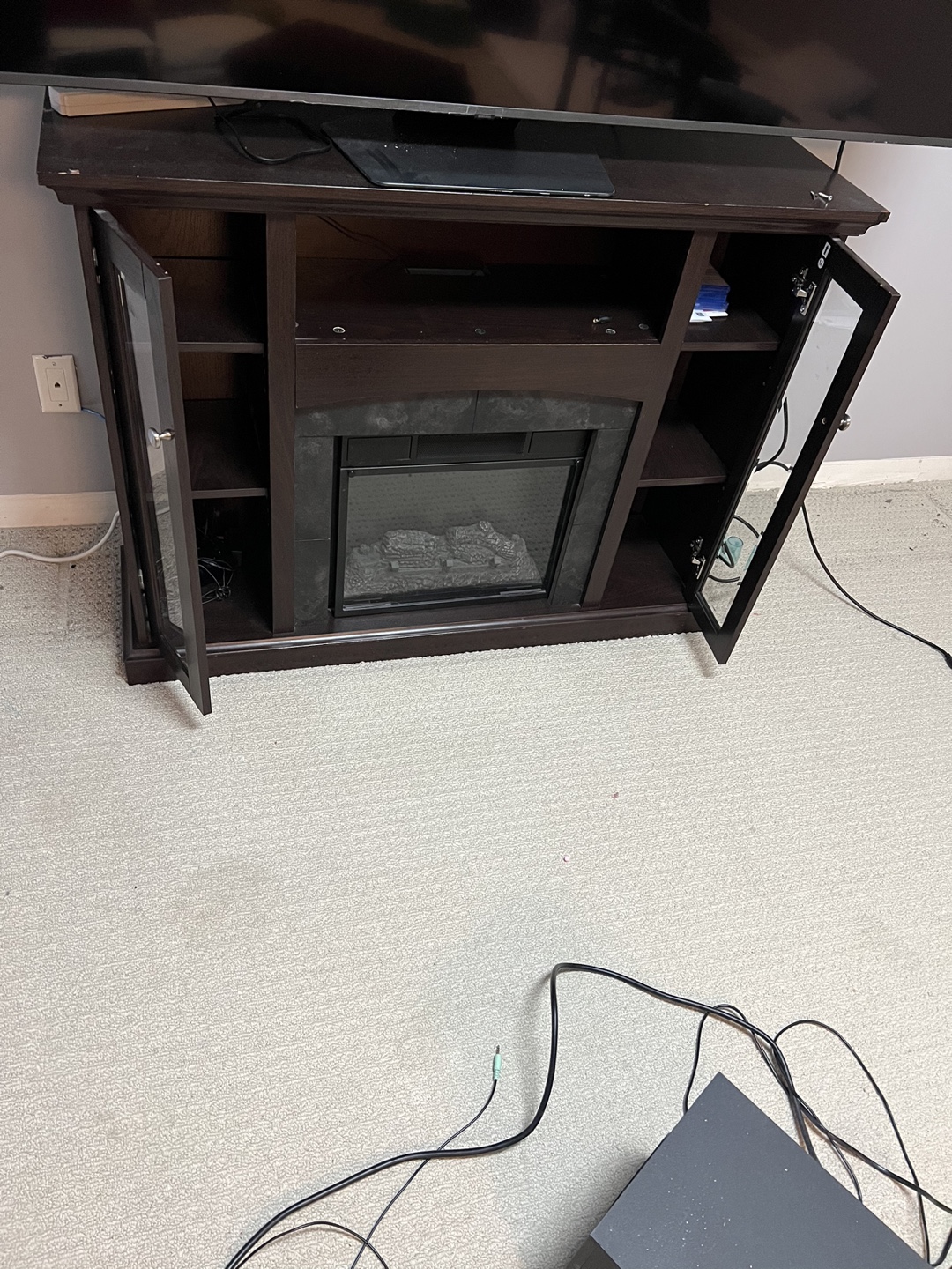 Fireplace , TV stand and book self - photo 4