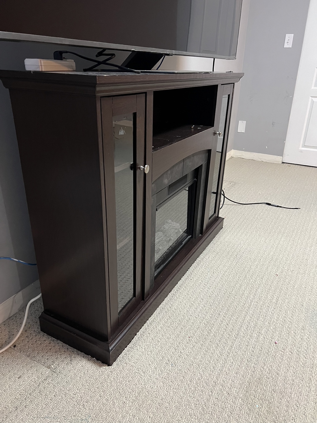 Fireplace , TV stand and book self - photo 2
