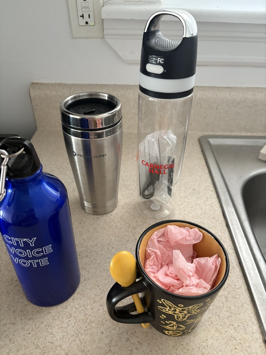 Assorted Water bottles and coffee mug
