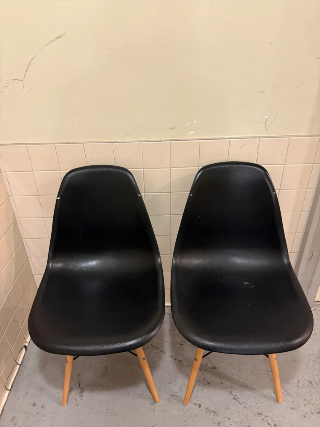 Black chairs with wooden legs thumbnail