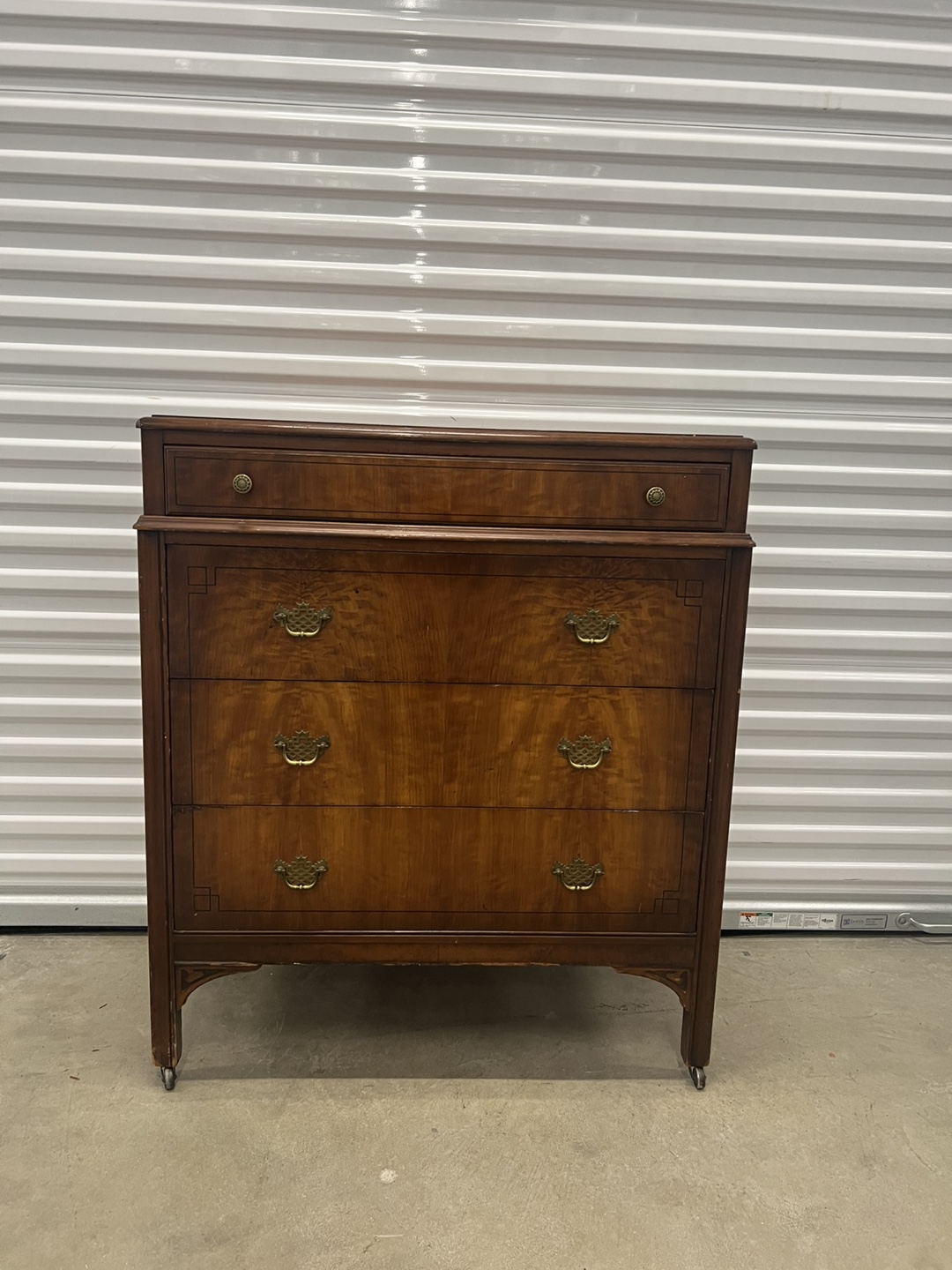 Antique tallboy Dresser rolls on casters