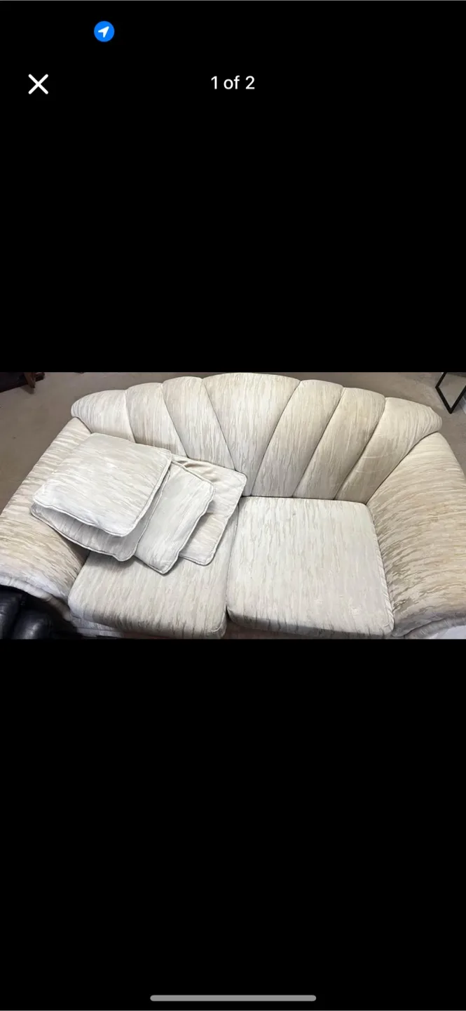 Two-seater beige sofa with cushions image indicator(2)