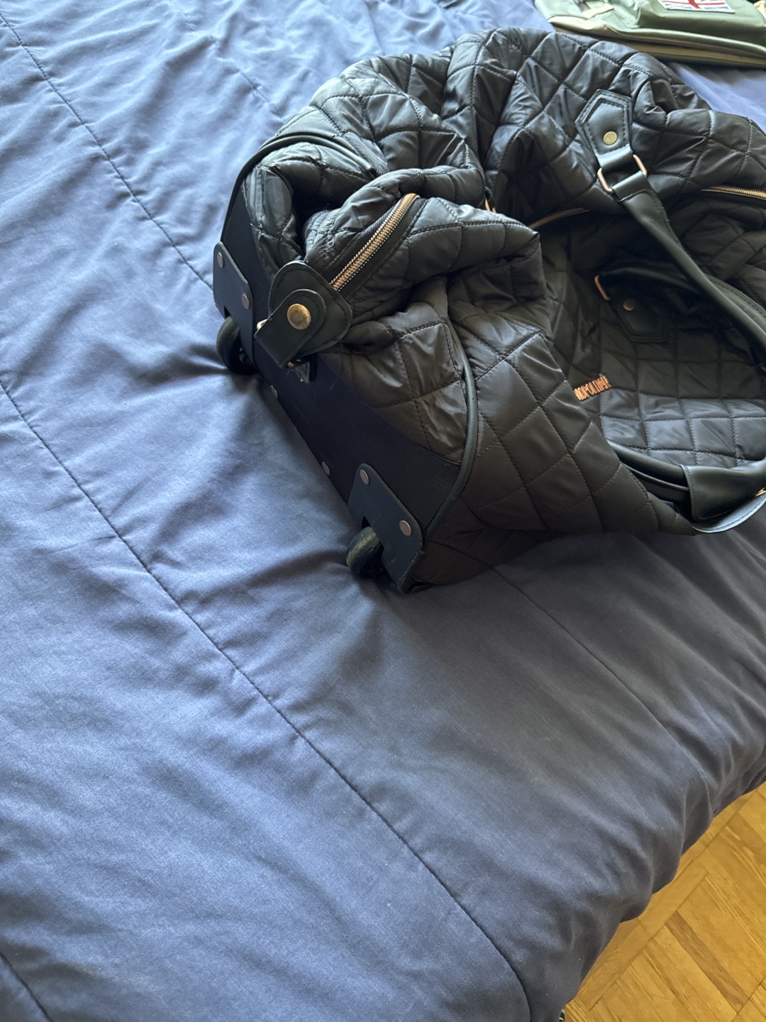 Cosmopolitan Quilted Rolling Duffel Bag - photo 3