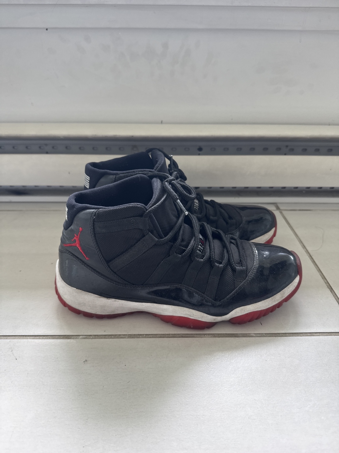 Nike Jordan 11 Retro Bred Sneakers - photo 2