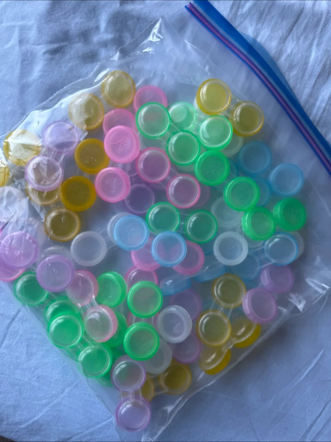 A bunch of contact lenses containers thumbnail