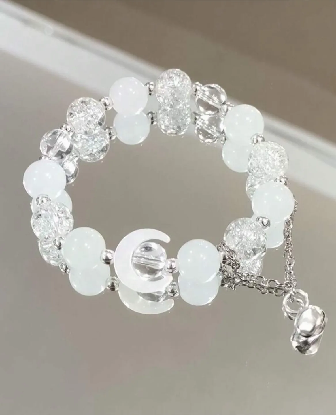 White beaded bracelet with charm thumbnail