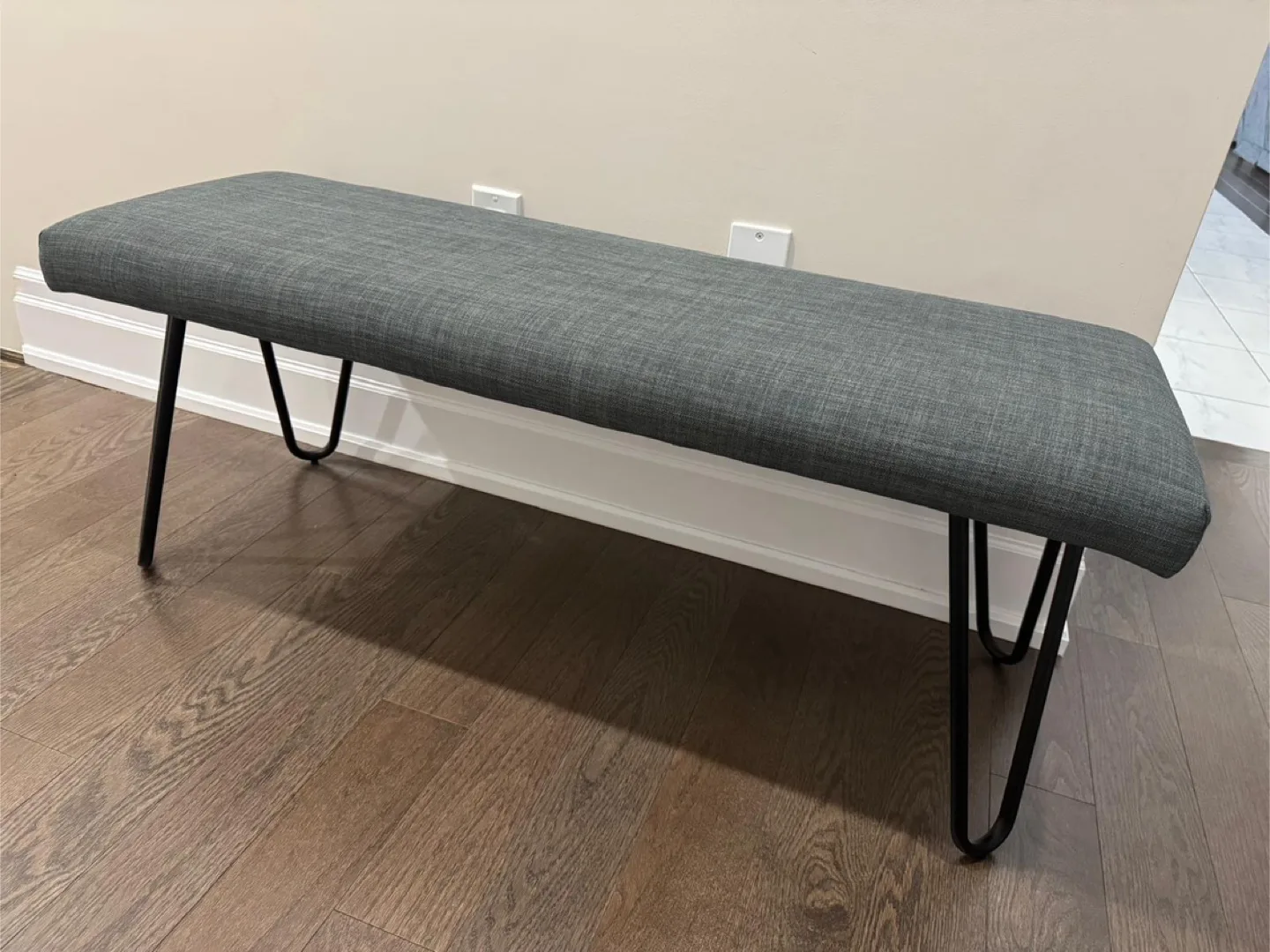Grey Upholstered Bench with Black Metal Legs thumbnail