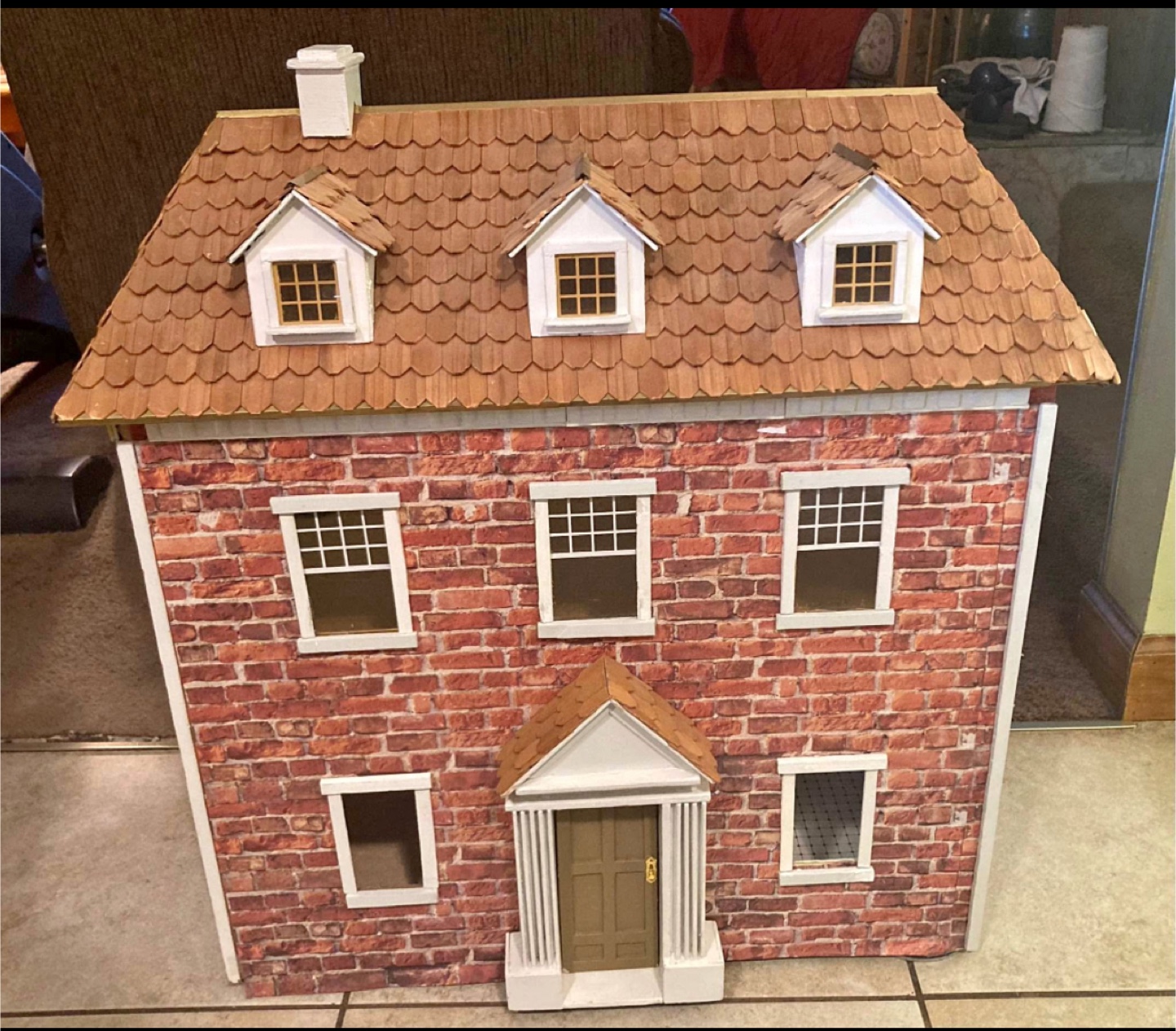 Wooden dollhouse with furniture