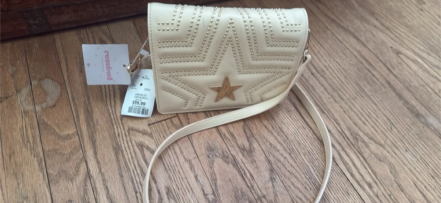 New cream colored handbag with a star design thumbnail