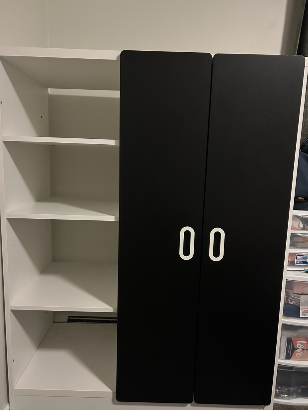 White and Black Shelving Unit with Doors